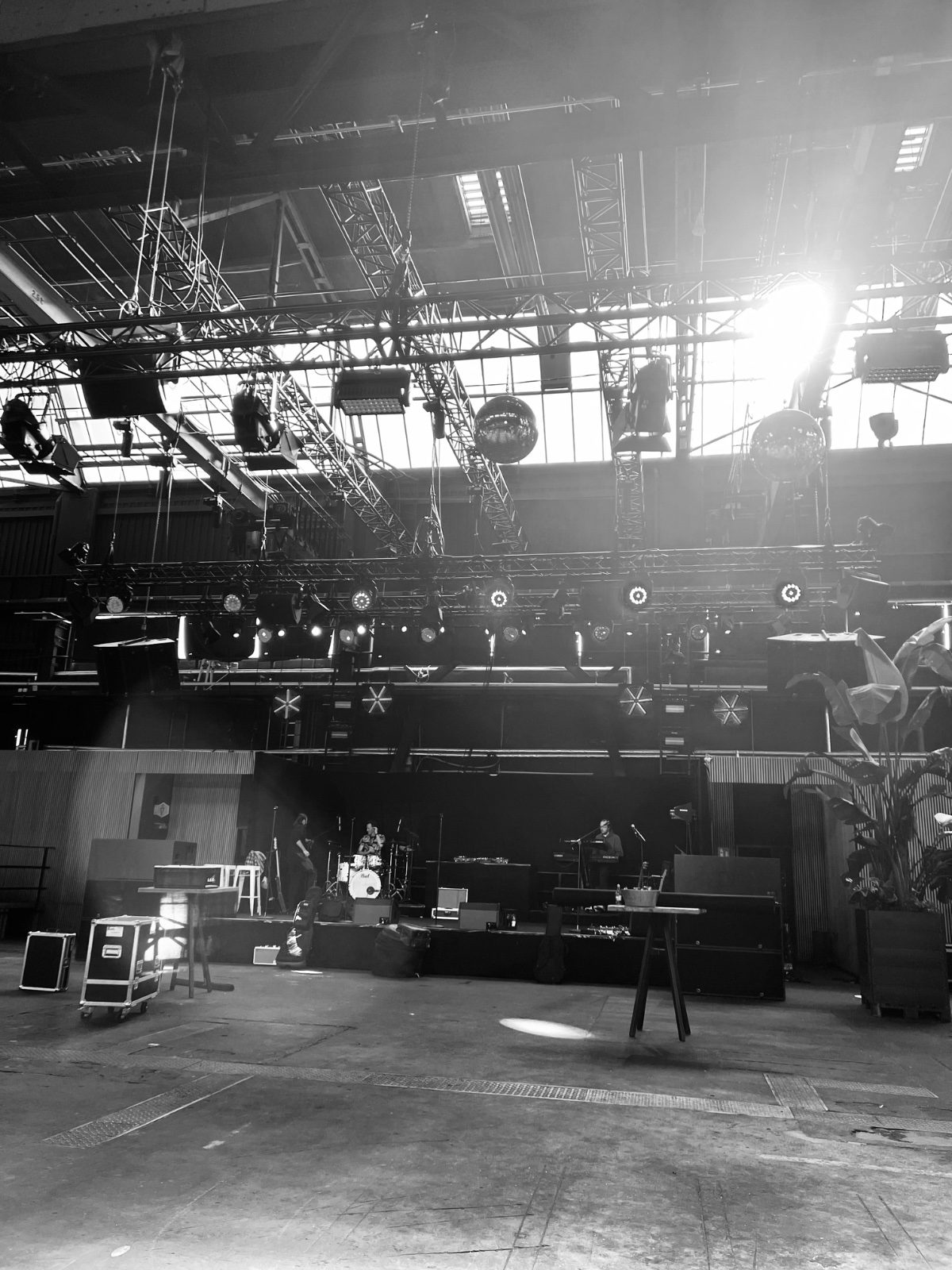 Empty venue before build-up, industrial hall with light pouring in